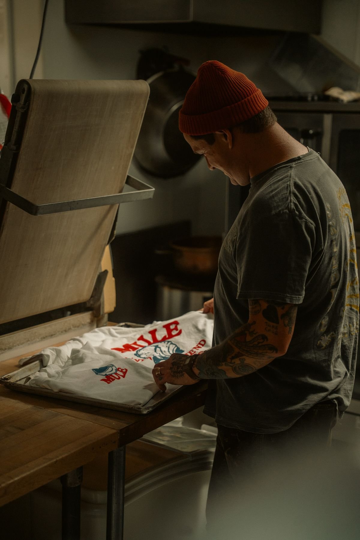 Screen printing a T-shirt in a creative workshop